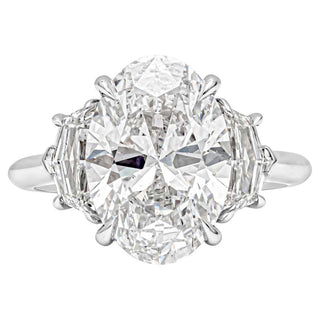 Elongated oval three stone moissanite engagement ring front view