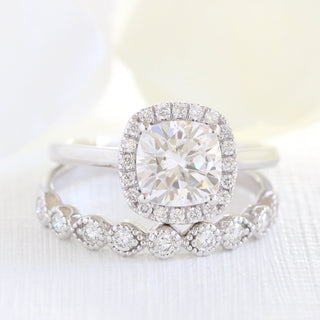 Delicate 2.30ct cushion halo moissanite ring three quarter angled view
