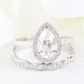 Lustrous 1.50ct pear halo moissanite ring three quarter angled view