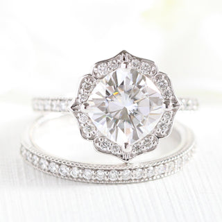 Shimmering 2.30ct cushion halo moissanite ring shown on a finger