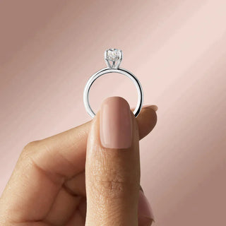 Brilliant 1.33ct pear hidden halo moissanite ring side profile view