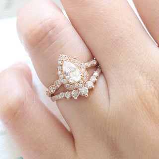 Refined 1.0ct pear halo moissanite ring top view