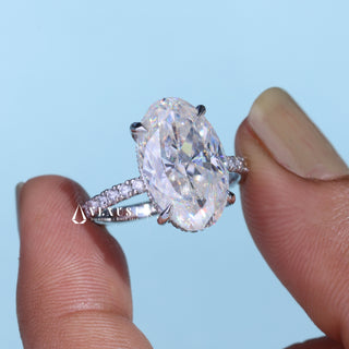 Graceful 6.0ct oval hidden halo moissanite ring angled view showing its sparkle