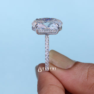 Graceful 6.0ct oval hidden halo moissanite ring shown on a finger