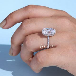Graceful 6.0ct oval hidden halo moissanite ring tilted view catching the light