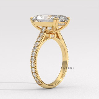 Side profile of a radiant cut moissanite engagement ring with a pave band from the left