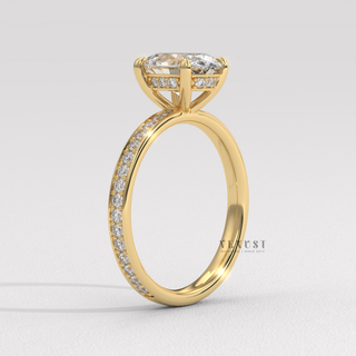 Oval cut moissanite engagement ring with a hidden halo and pave band shown on a finger