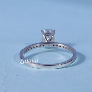 Pave Elongated Cushion Cut Moissanite Ring resting on its side showing the slim band