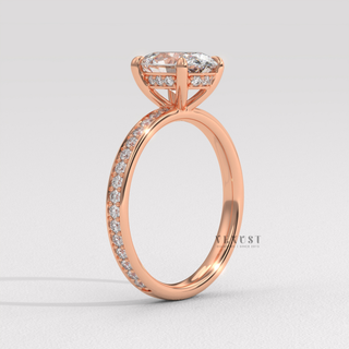 Overhead close-up of a oval cut moissanite engagement ring with a hidden halo and pave band