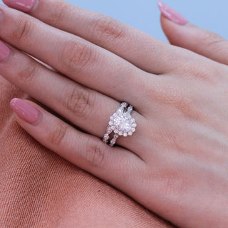 Sparkling 1.50ct oval halo moissanite ring tilted view catching the light