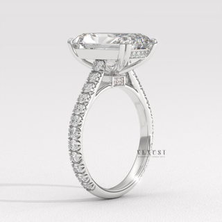 Side profile of a radiant cut moissanite engagement ring with a pave band under soft light