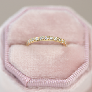 Vintage round half eternity moissanite wedding band close up of the setting image 3
