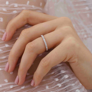 Lustrous 0.44ct round full eternity moissanite wedding band close up of the setting
