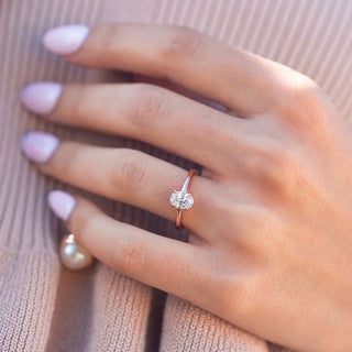 Gorgeous 1.33ct oval solitaire moissanite ring shown on a finger