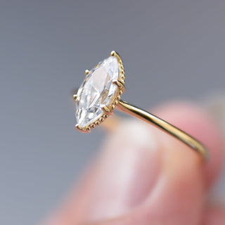 Shimmering 1.0ct marquise solitaire moissanite ring side profile view