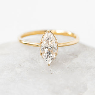 Shimmering 1.0ct marquise solitaire moissanite ring angled view showing its sparkle