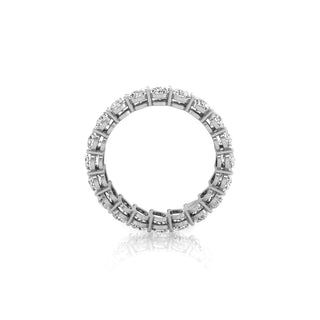 Lustrous pear eternity moissanite wedding band side profile view