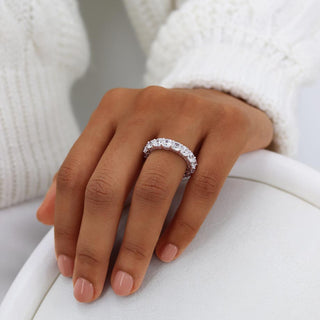 Modern 5.61ct cushion full eternity moissanite wedding band close up of the setting