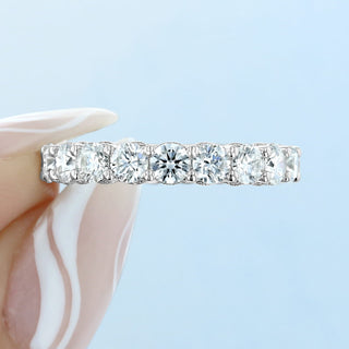Dazzling round full eternity moissanite wedding band close up of the setting image 2