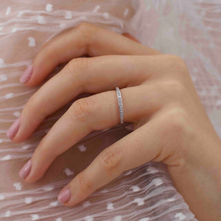 Brilliant 0.16ct round half eternity moissanite wedding band side profile view