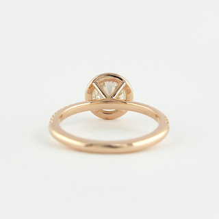 Exquisite 1.0ct round halo moissanite ring shown on a finger