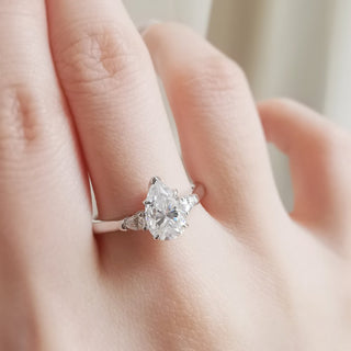 1-50-ct-pear-shaped-moissanite-three-stone-engagement-ring