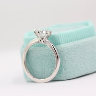 Chic 1.0ct round solitaire moissanite ring side profile view