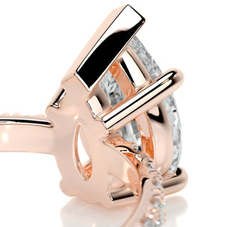 Delicate 1.5ct pear hidden halo moissanite ring angled view showing its sparkle