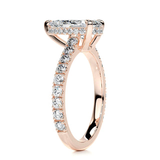 Shimmering 1.5ct pear hidden halo moissanite ring side profile view
