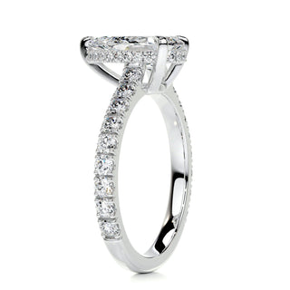 Shimmering 1.5ct pear hidden halo moissanite ring tilted view catching the light