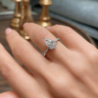 Shimmering 1.5ct pear hidden halo moissanite ring three quarter angled view