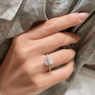Shimmering 1.5ct pear hidden halo moissanite ring detail view of the band