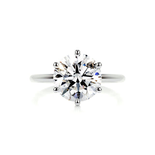 Luminous 2.0ct round solitaire moissanite ring shown on a finger