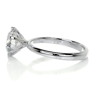Radiant 2.5ct round solitaire moissanite ring tilted view catching the light