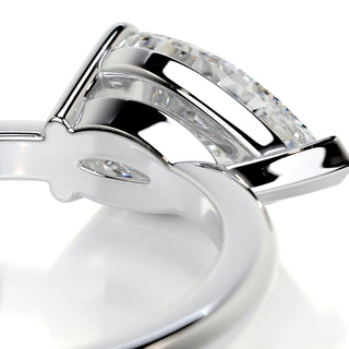 Shimmering 1.0ct pear solitaire moissanite ring macro detail of the stones