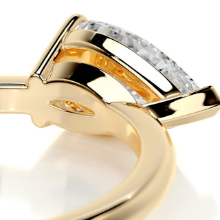Shimmering 1.0ct pear solitaire moissanite ring angled view showing its sparkle