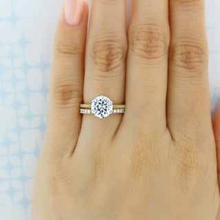 Bold round full eternity moissanite wedding band shown on a finger
