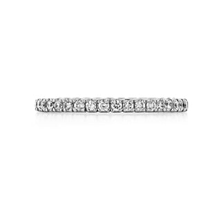 Refined round full eternity moissanite wedding band angled view showing its sparkle