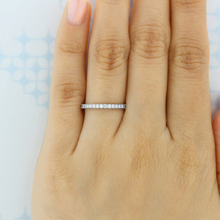 Modern round full eternity moissanite wedding band top view