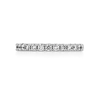 Elegant round full eternity moissanite wedding band angled view showing its sparkle image 2