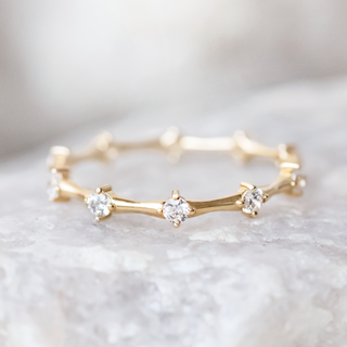 Radiant round full eternity moissanite wedding band side profile view