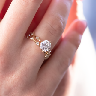 Radiant round full eternity moissanite wedding band angled view showing its sparkle