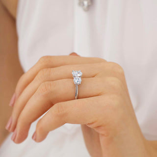 Gorgeous 1.50ct round three stone moissanite ring angled view showing its sparkle
