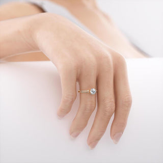 Timeless 1.50ct round solitaire moissanite ring shown on a finger