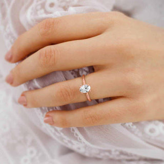 Radiant 0.90ct oval solitaire moissanite ring angled view showing its sparkle