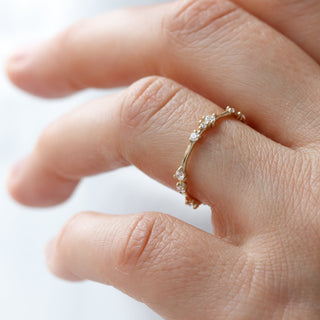 Graceful round half eternity moissanite wedding band front view image 2