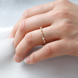 Graceful round half eternity moissanite wedding band close up of the setting image 2