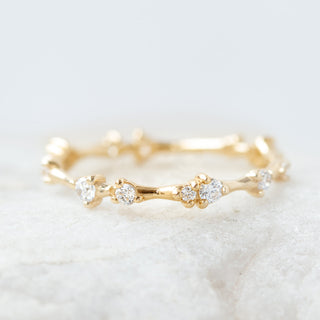 Graceful round half eternity moissanite wedding band side profile view image 2