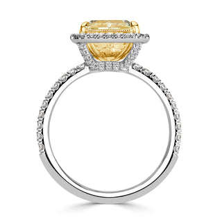 Yellow radiant moissanite halo ring close up detail