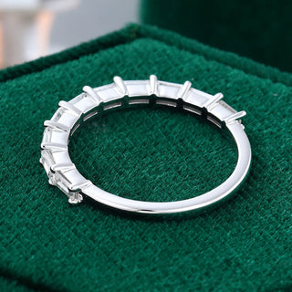 Gorgeous 0.11ct baguette moissanite wedding band shown on a finger